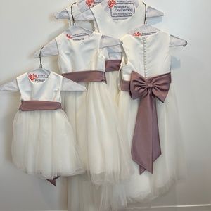 David’ Bridal Flower Girl Dresses Ivory with mauve or Ivory bow.